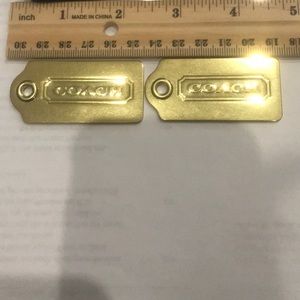 2 brass tags